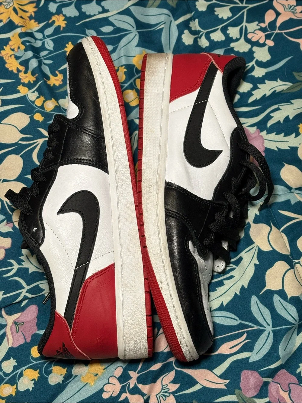 Jordan 1 Low Black and White Sneakers with Red Logo Accent